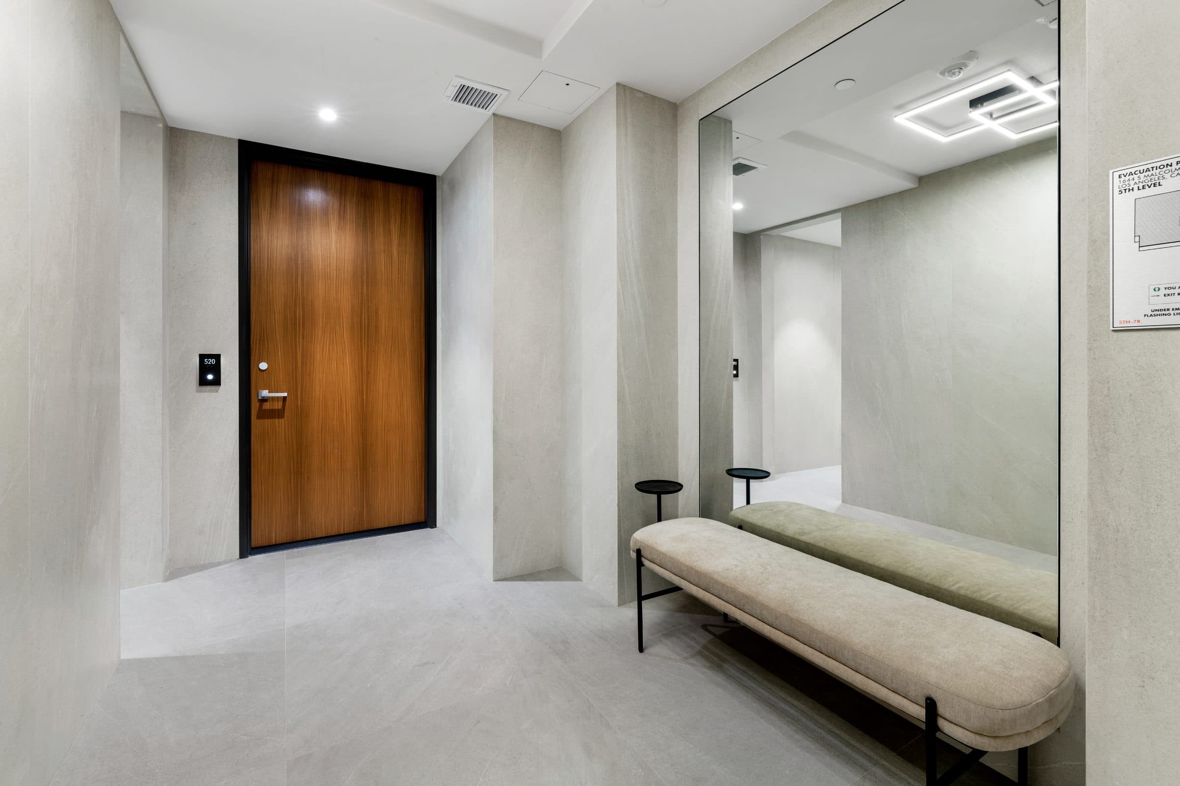 Private elevator landing in honed stone at Lumiere at Malcolm