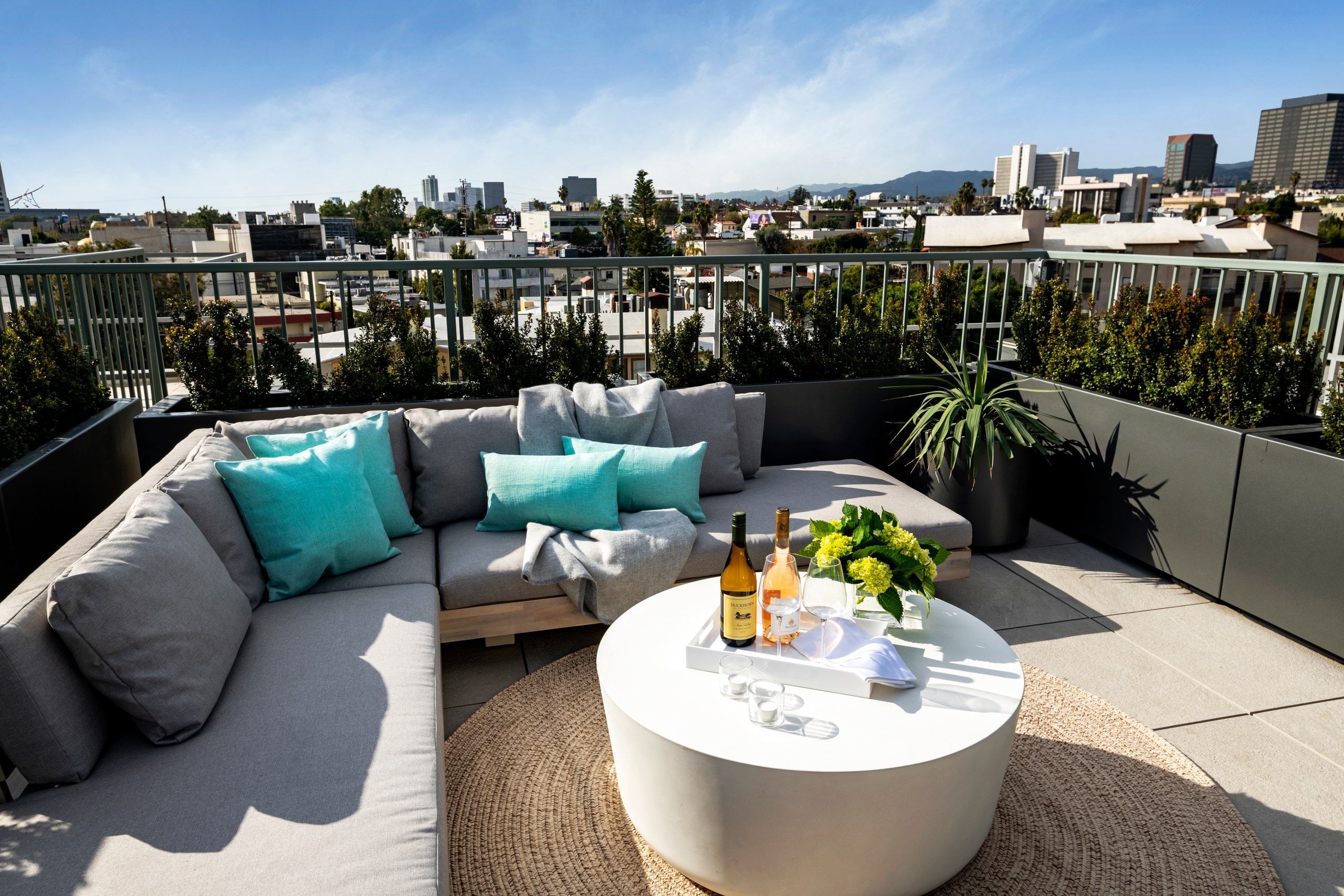 Rooftop lounge with Los Angeles skyline views at Lumiere at Malcolm