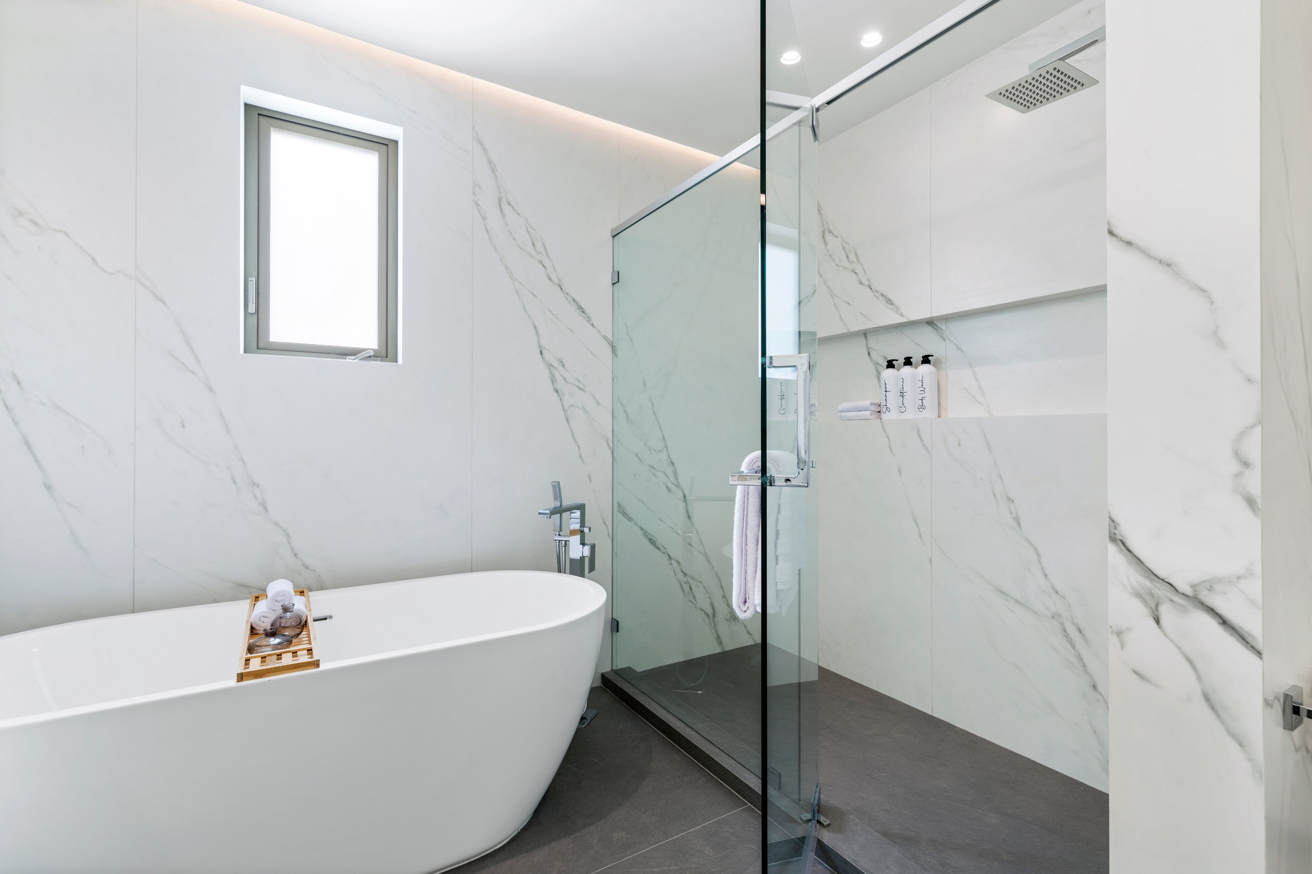 Spa bath with a freestanding soaking tub at Lumiere at Malcolm