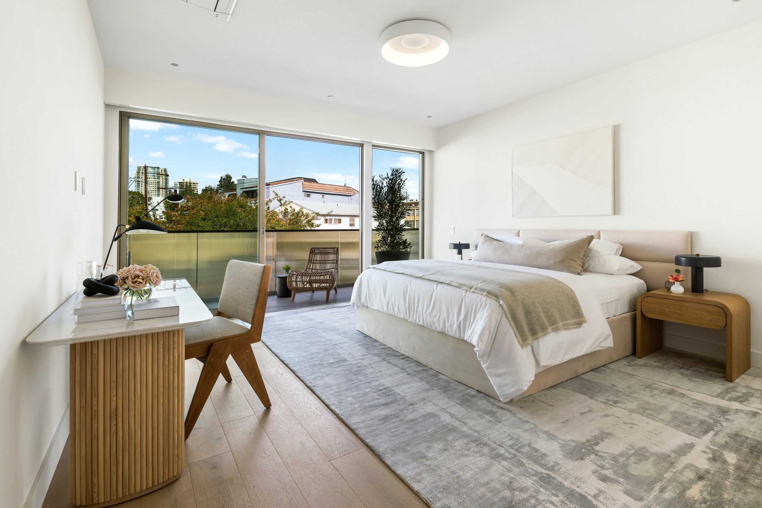 Primary suite with terrace access and skyline view at Lumiere at Malcolm