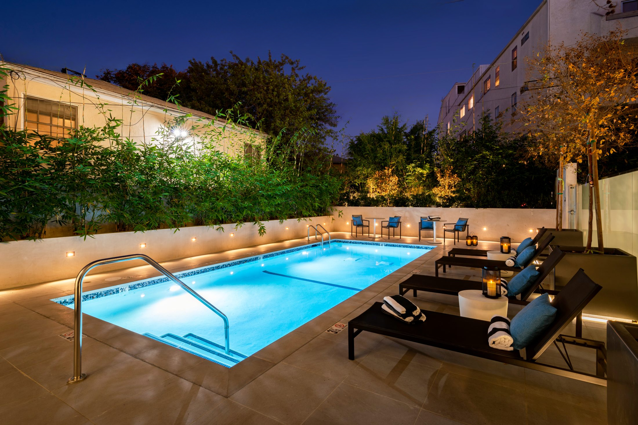 Resort-style salt water pool with lounge seating at Lumiere at Malcolm